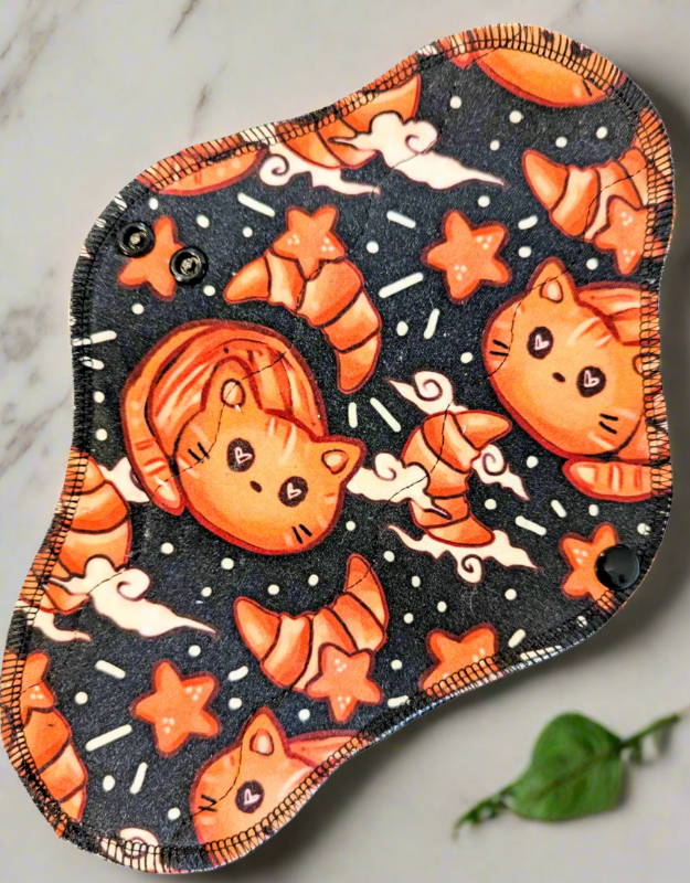 hand-drawn bread shaped cats, stars and croissants.