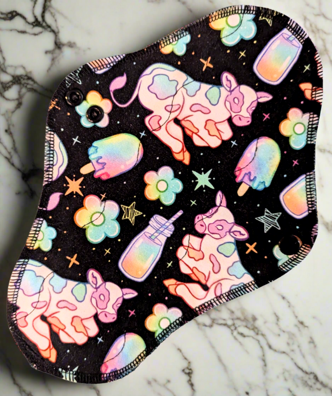 Black background rainbow drawn cows, glasses of milk with straws, ice cream popsicles, flowers, and stars, beautiful