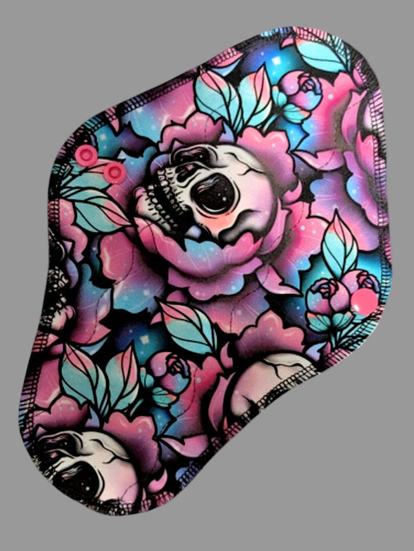 Skull Blossom beautiful flowers with the largest blossoming a skull. Pinks, blues, purples and greens