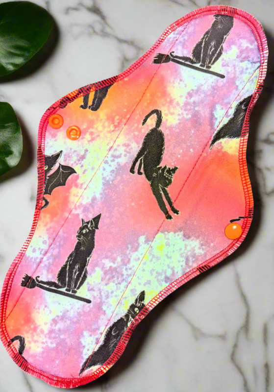 Spooky, black, wings, witchy cats, with brooms, wands and stretching.