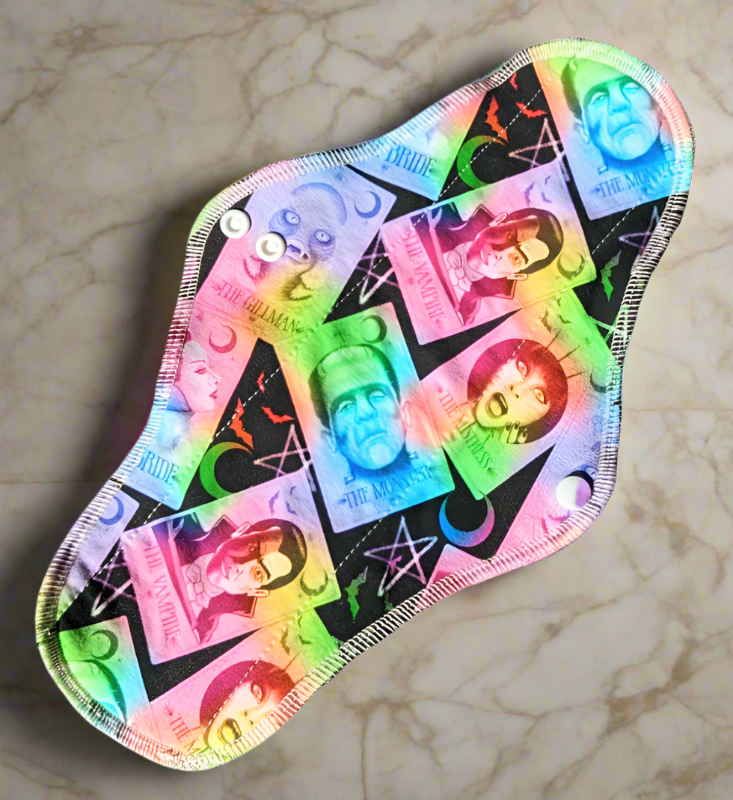 Monster Tarot – Featuring iconic monsters like Dracula, Frankenstein, and more, adorned in vibrant rainbow hues.