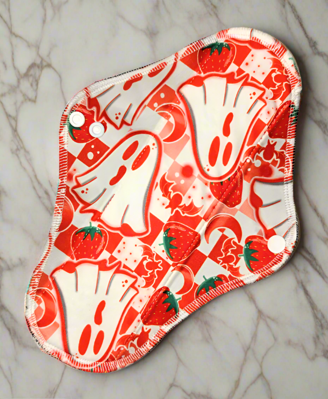 Boo Berry cloth pad white background red ghosts with bats, strawberries, and a red and white checkerboard