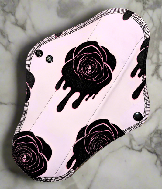 Dripping Roses Light pink background Black roses with a dripping design