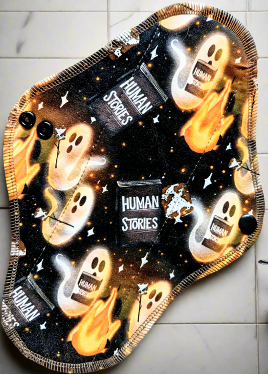 Human Stories - Cotton Spandex  Ghosts around campfire with marshmallows and smores reading from a book of Human Stories