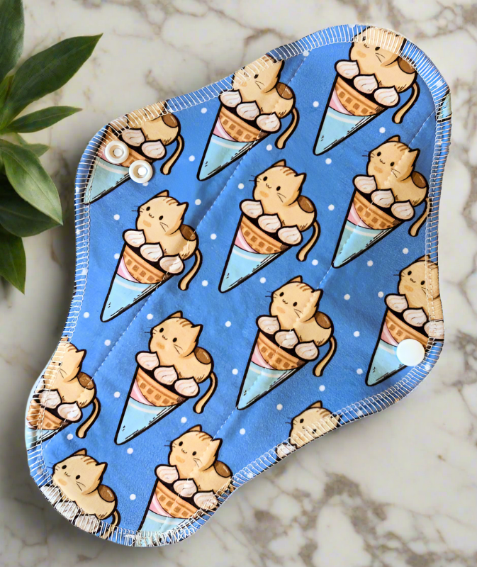 Ice Cream Kitties – Blue kitties posing as ice cream cones.