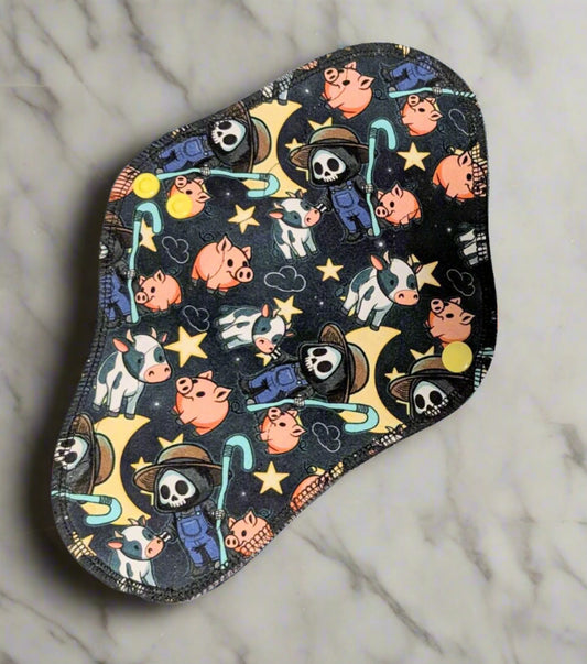 Reusable cloth pad with Reaper dressed as farmer with pigs and cows