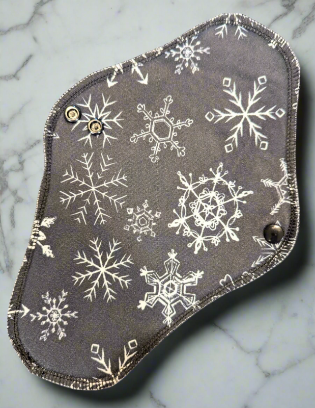 Snowflake – A dark grey design featuring intricate snowflakes scattered across the fabric.