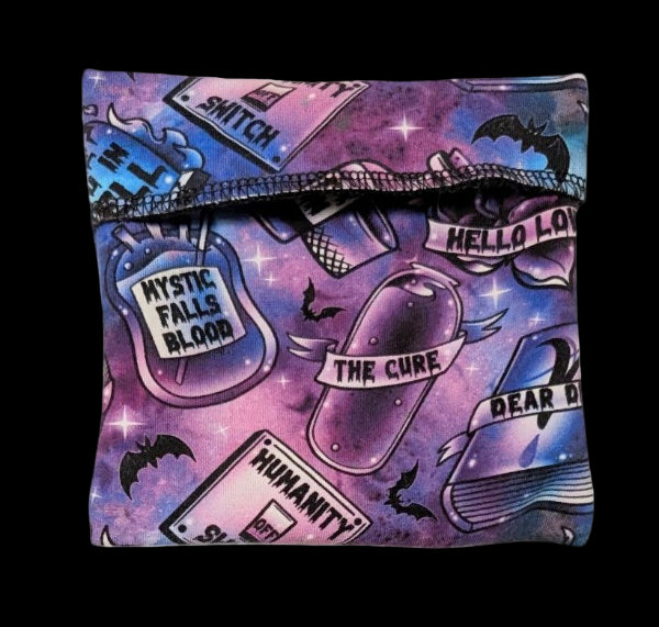 Colorful patterned pouch with text and graphics on a white background